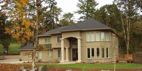 Two-story custom home with stucco and stone exterior