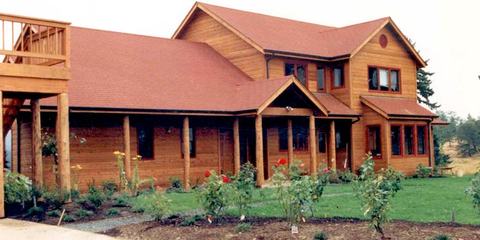 Wood-sided home with wraparound deck