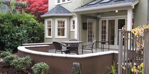 Home with covered porch and balcony