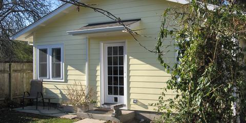 Small detached cottage with landscaping