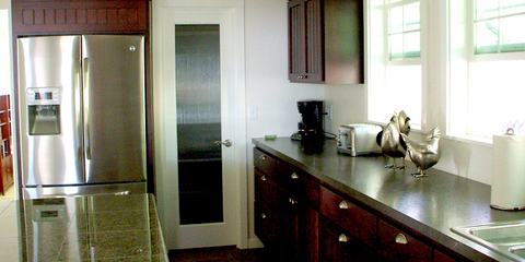 Remodeled kitchen with stainless refrigerator